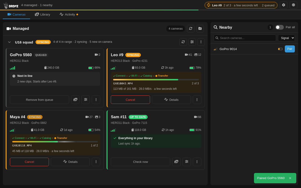 Cameras tab: managed cards in groups, one syncing
